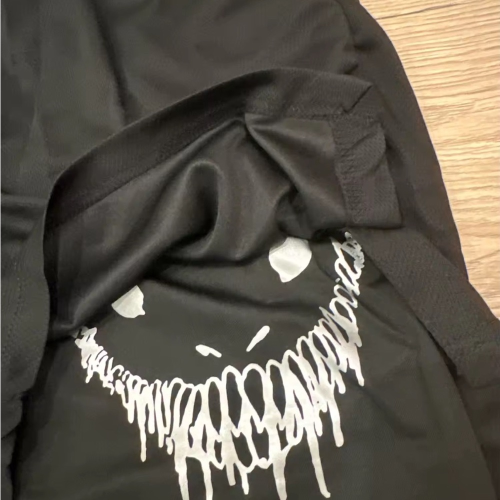 Black Graphic T-Shirt with White Drip Design